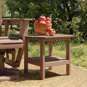  outdoor oval table with a bowl of apples on a grassy area