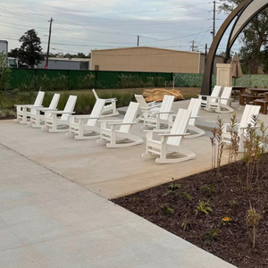 White Savannah Rockers in a square concrete space