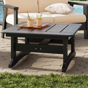 Black square coffee table with a pool in the background
